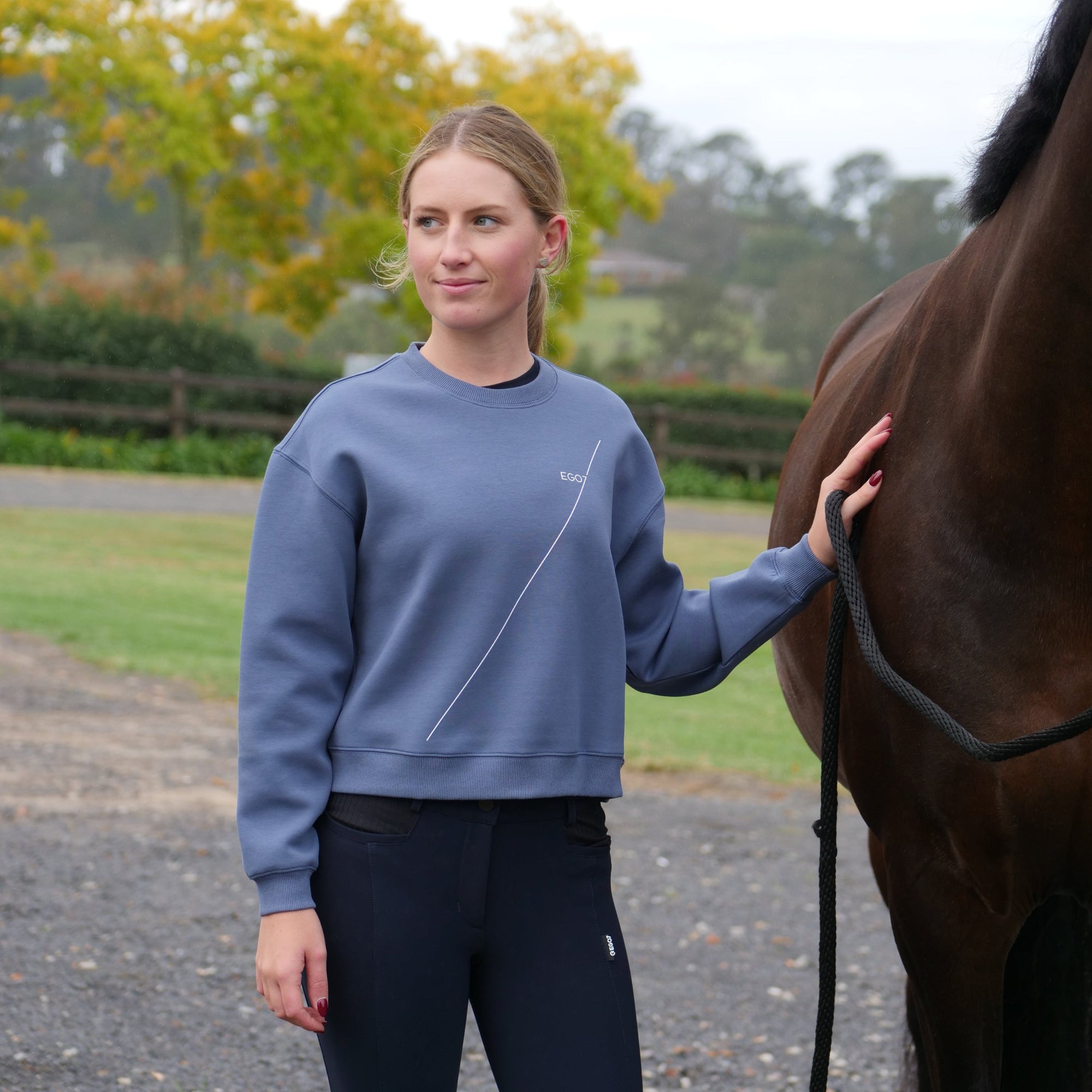 EGO7 women's cropped equestrian sweatshirt worn at the barn