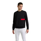 Man wearing the black EGO7 Dorian Men's Sweatshirt with signature red chest tape detail and white riding breeches.