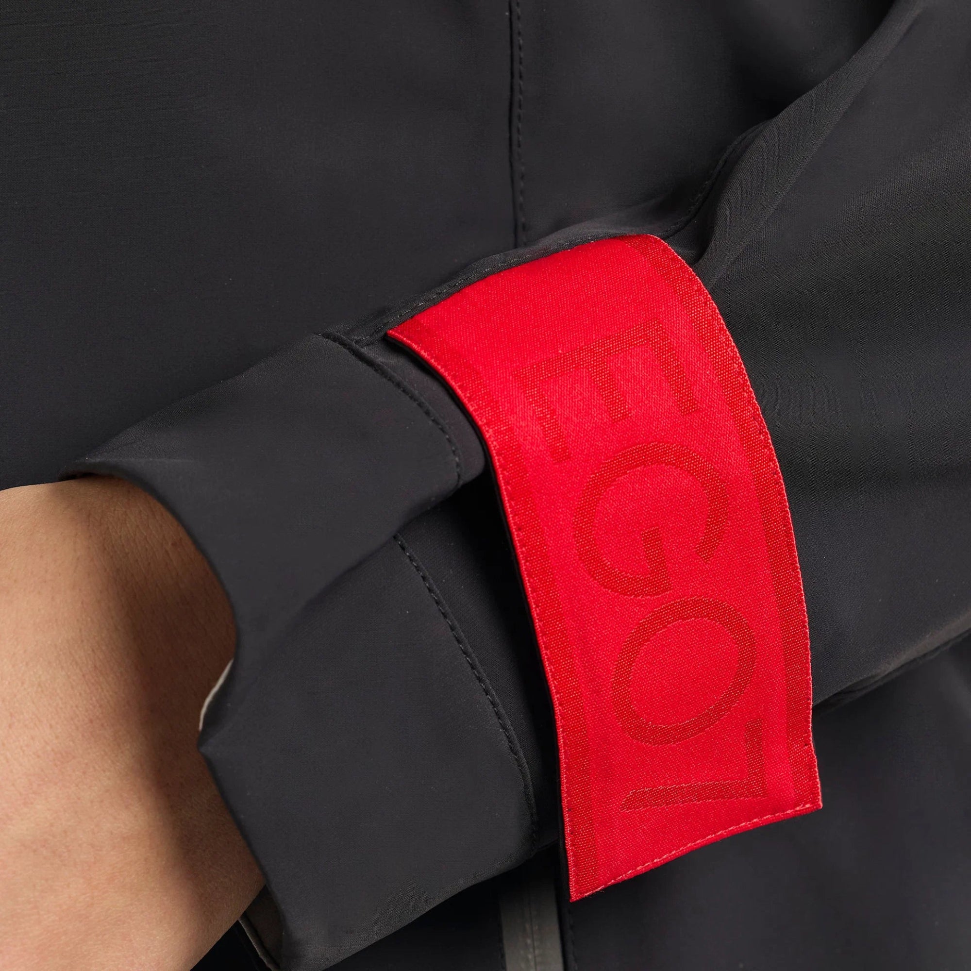 EGO7 Iris Women's Waterproof Jacket Black cuff and red EGO7 logo detail
