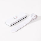 White EGO7 men's equestrian horse head show tie laid flat next to its branded white gift box.