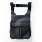 Front view of the black EGO7 Rosalie equestrian backpack featuring waterproof soft-touch fabric and front snap pockets