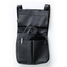 Front view of the open black EGO7 Rosalie Backpack displaying front snap pockets, pen holder, and organized storage for accessories