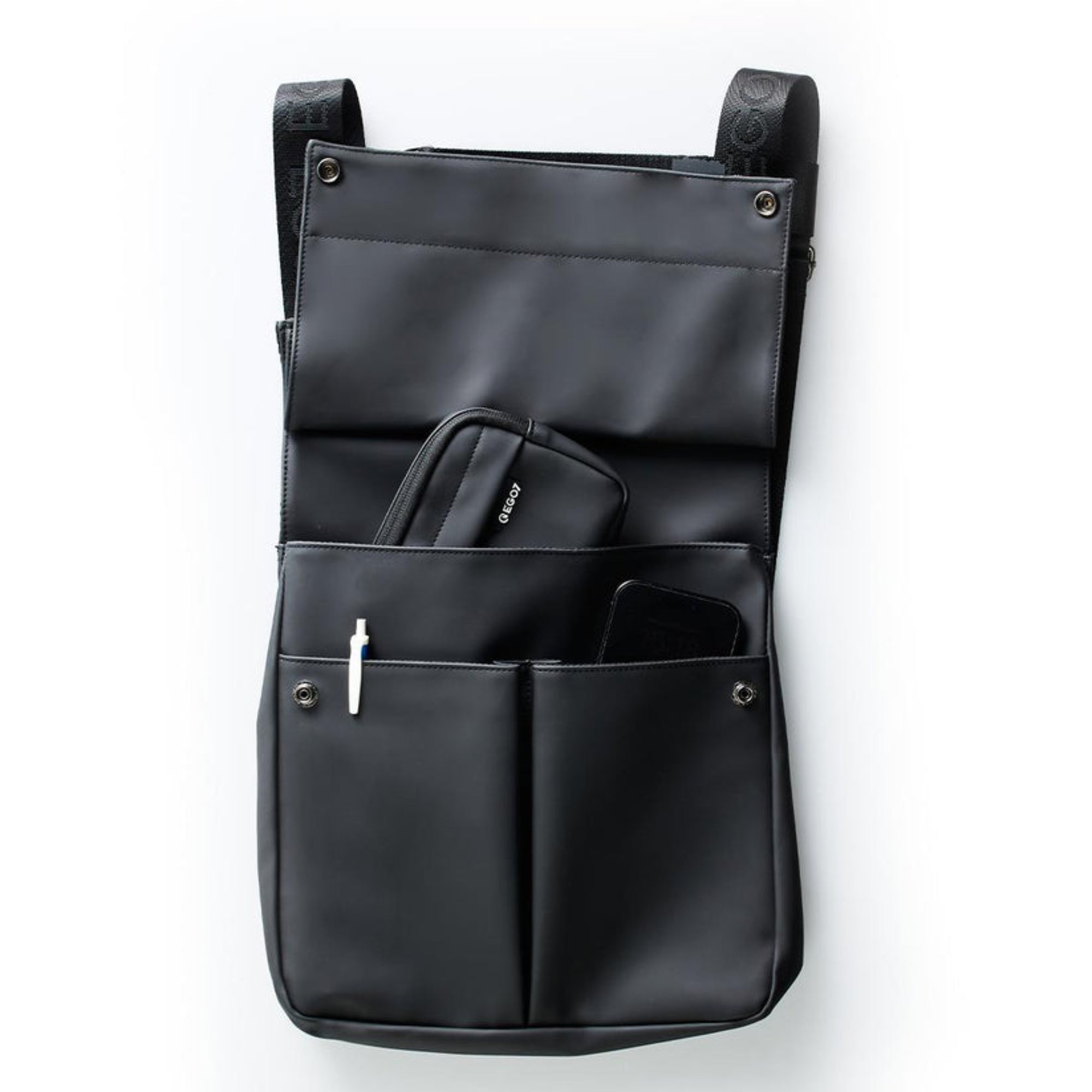 Front view of the open black EGO7 Rosalie Backpack displaying front snap pockets, pen holder, and organized storage for accessories
