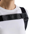 Close-up detail of the adjustable chest strap and micro-injected logo on the black EGO7 Rosalie Backpack
