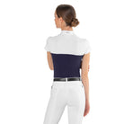 Back view of a female rider wearing the navy blue EGO7 Mesh Women's Short Sleeve Show Shirt with white mesh shoulders and stand-up collar