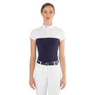 Front view of a female rider wearing the navy blue EGO7 Mesh Women's Short Sleeve Show Shirt with white mesh shoulders and stand-up collar