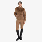 Equestro Women's Faux Fur Jacket in Tobacco Brown worn with breeches and tall boots