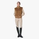 Equestro Women's Faux Fur Vest in Tobacco Brown worn with breeches and tall boots