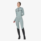 Equestro Women's Monogram Long Sleeve Training Polo in Slate Grey worn with breeches and tall boots
