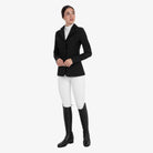 Equestro Women's Monogram Velvet Competition Jacket in Black worn with white breeches and tall boots