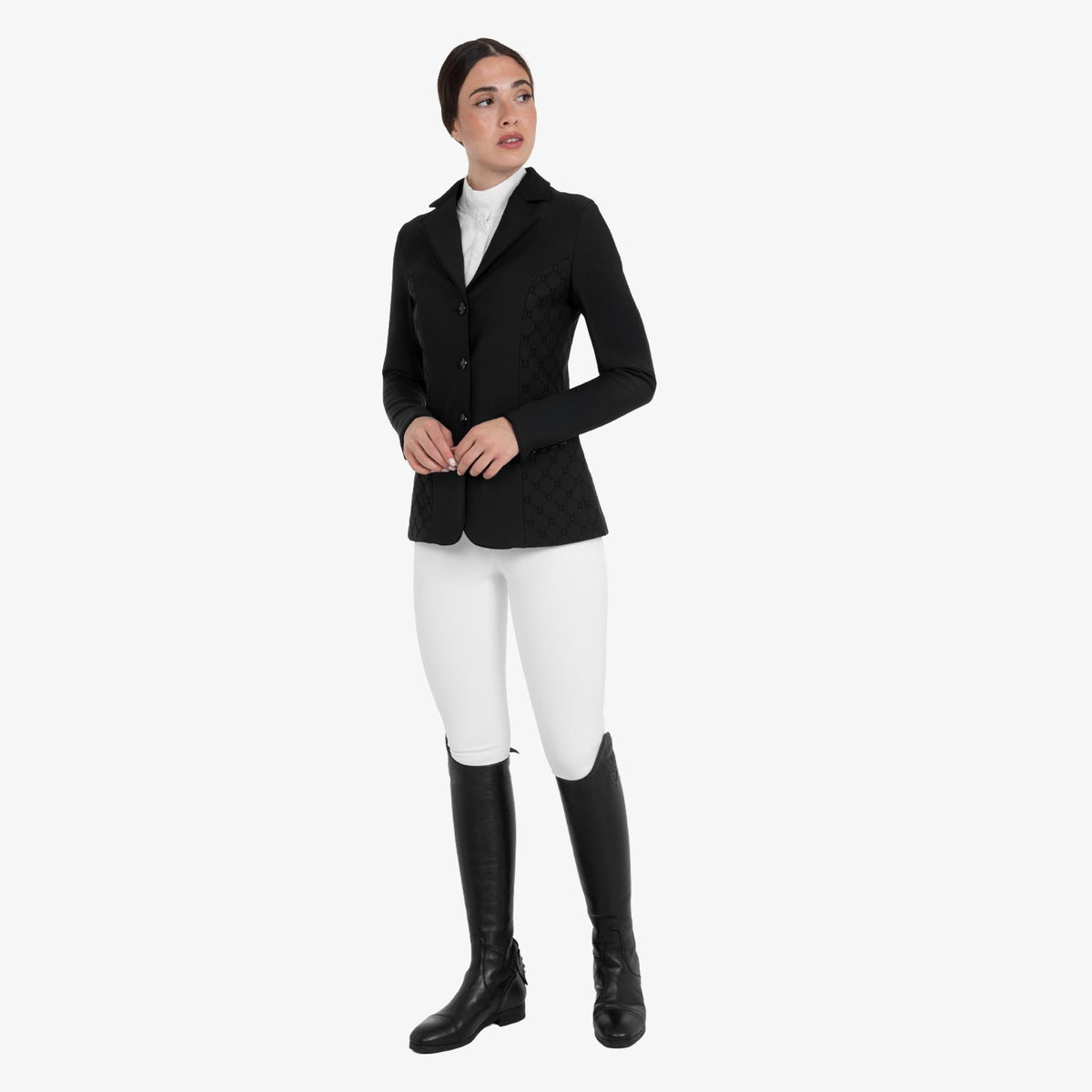 Equestro Women's Monogram Velvet Competition Jacket in Black worn with white breeches and tall boots