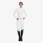 Equestro Women's Perforated Long Sleeve Competition Polo in White worn with breeches and tall boots