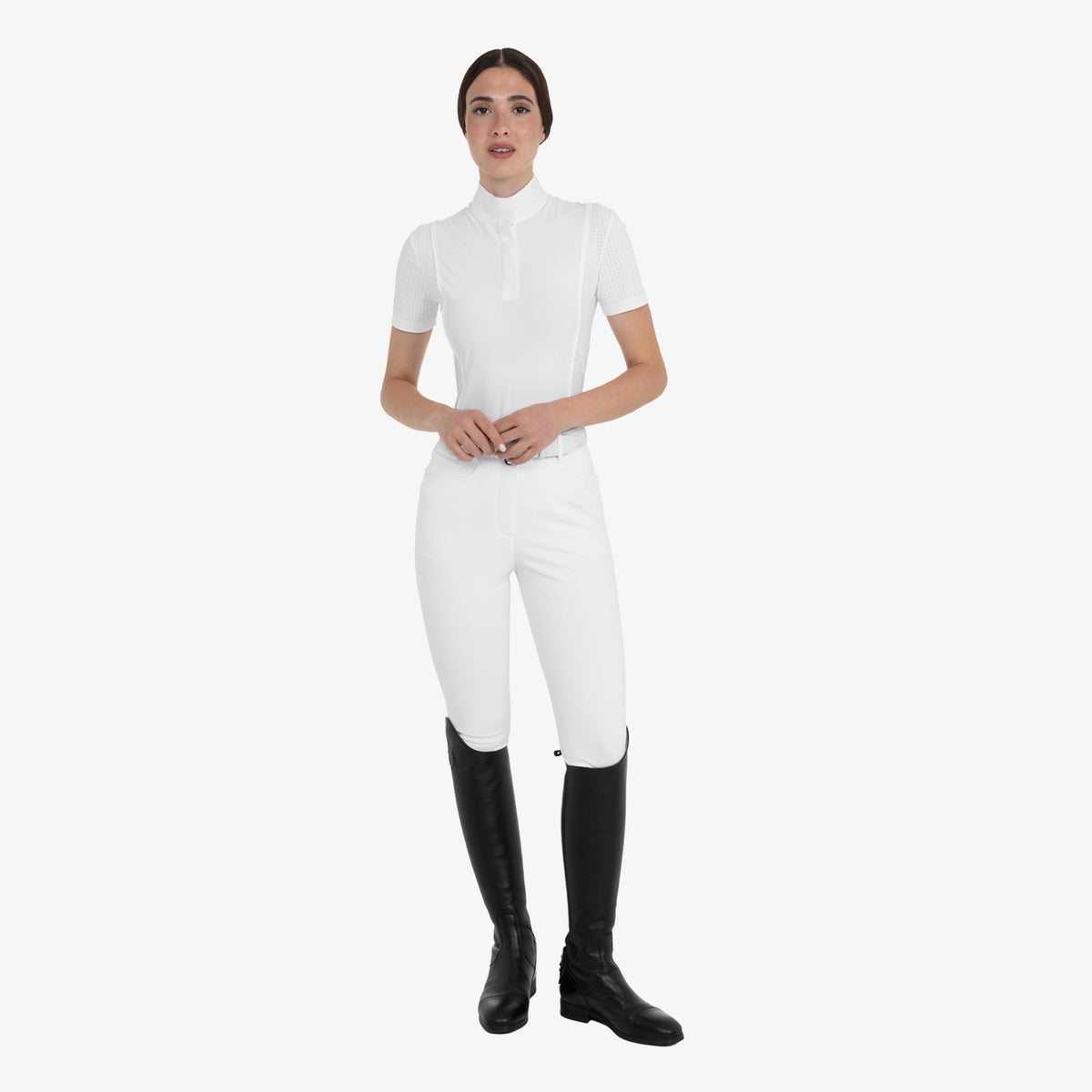 Equestro Women's Hunter Knee Grip Breeches - White, worn with show shirt and tall boots | Malvern Saddlery