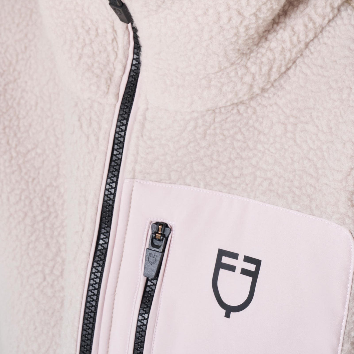 Equestro Women's Teddy Fleece Zip Hoodie - Hushed Violet, close-up of zip pocket and logo | Malvern Saddlery