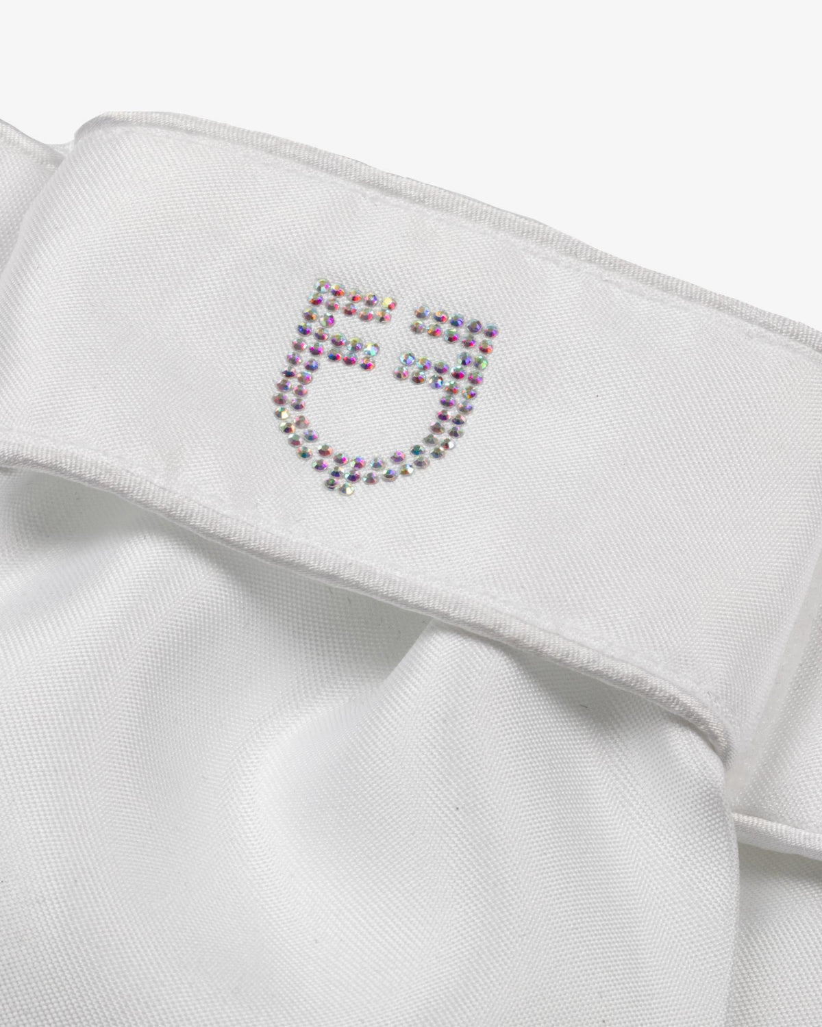 Equestro Lancelot Dressage Stock - White; close up of rhinestone logo | Dressage Accessories | Malvern Saddlery
