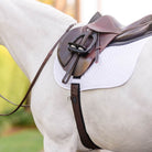 Brown EquiFit Essential Schooling Girth on a horse, viewed from the side during a ride to highlight its contoured shape and fit