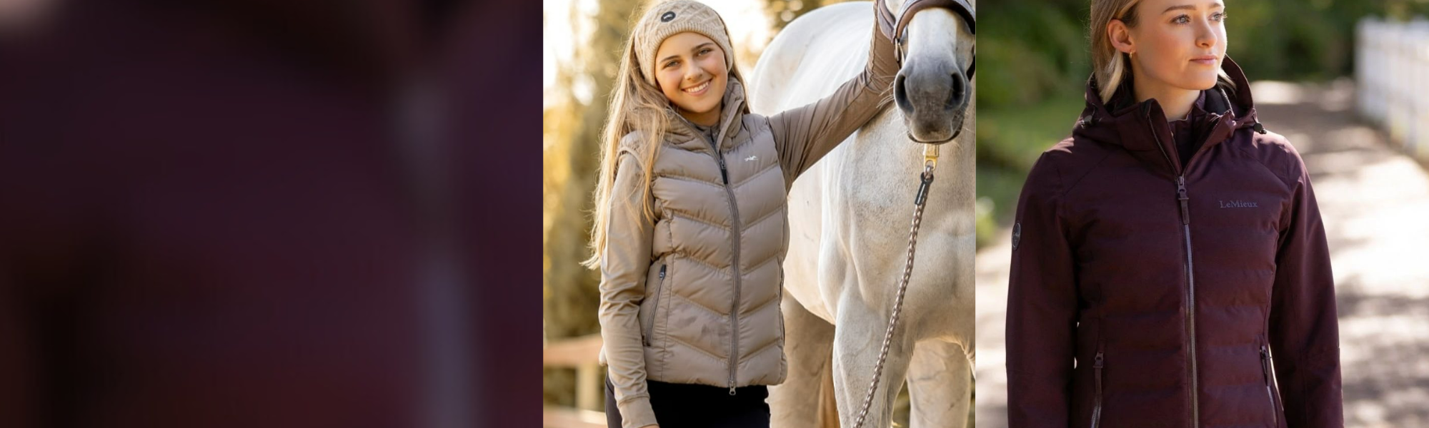 Two women in winter coats standing next to a horse on a path.
