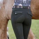 Halter Ego Women's Kimberly Full Grip Breeches - Army Green, back view of silicone seat next to a horse | Malvern Saddlery