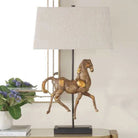Olsen Equestrian Table Lamp - Decorative table lamp with horse sculpture and white lampshade on a surface | Malvern Saddlery