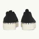 Rear view of Black Ilse Jacobsen Tulip 3373 Platform Slip-On shoe displaying signature hand-stitched construction and embossed heel logo.