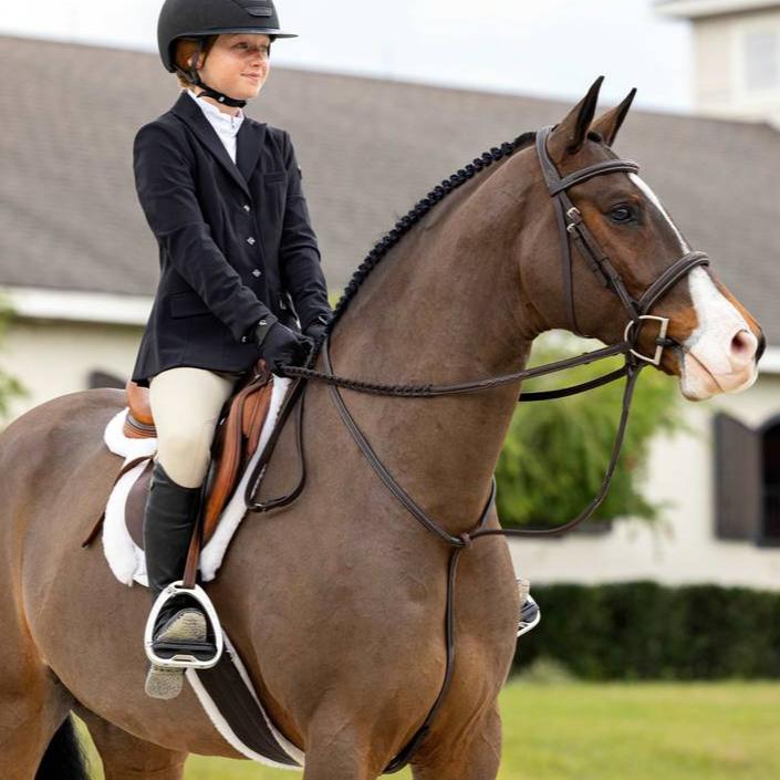 LeMieux Fancy Stitched Hunter Bridle, laced reins & standing martingale shown on chestnut horse with rider - Havana/Silver | Malvern Saddlery