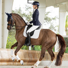 LeMieux ProSorb Plain 2 Pocket Dressage Square Saddle Pad - White, shown on chestnut horse with rider | Malvern Saddlery