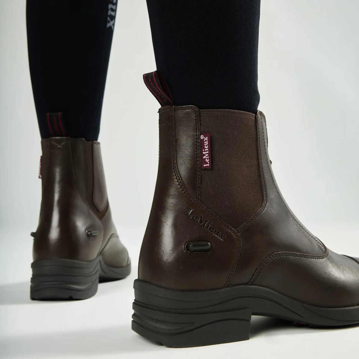 Close-up side view of brown leather LeMieux Women’s Zip Paddock Boot showing elastic Chelsea gusset, heel counter, and spur rests