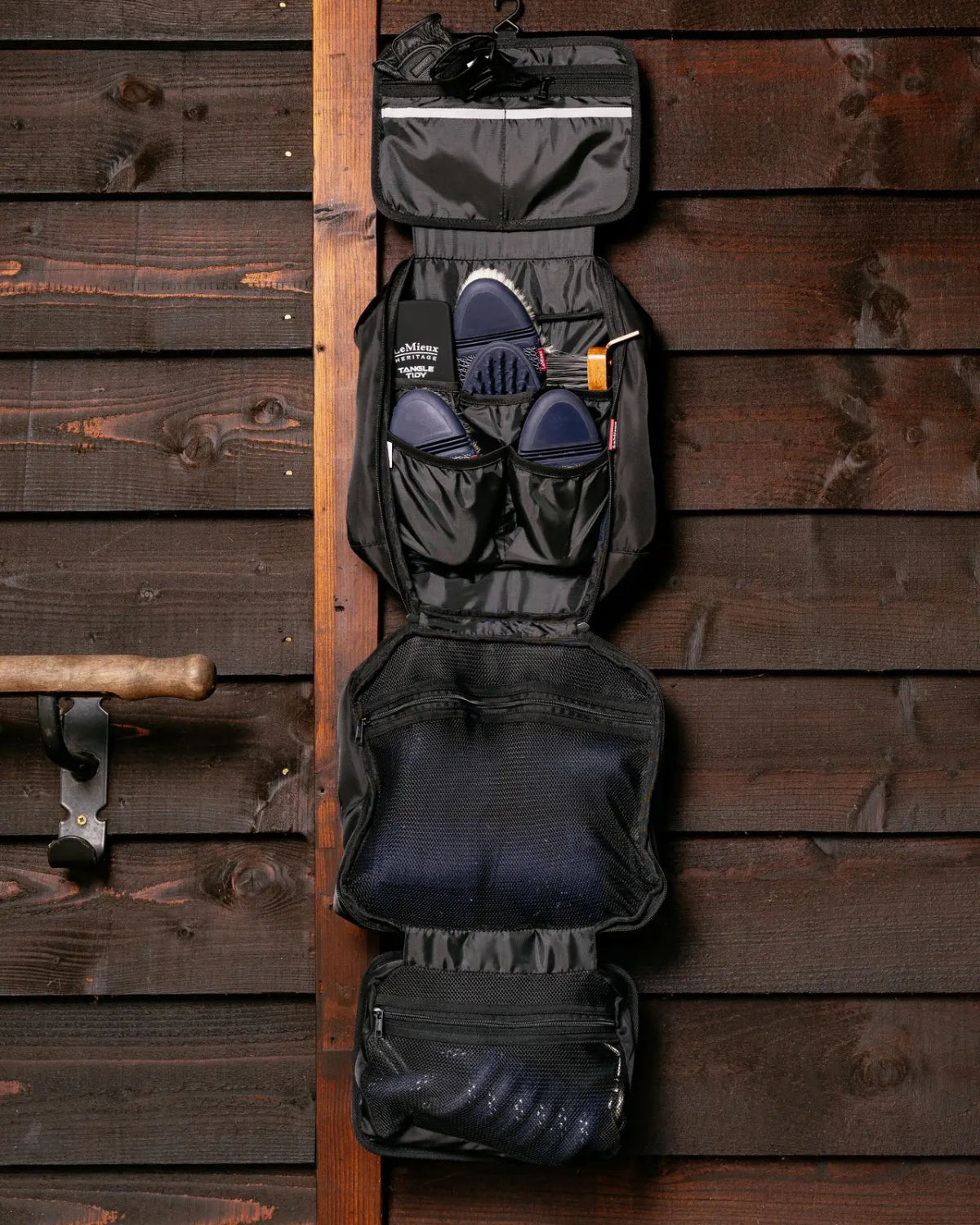 LeMieux Fold Down Pocket Organizer - Black, shown open, with grooming supplies [sold separately] | Equestrian Grooming Accessories | Malvern Saddlery