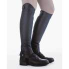 Kavalkade Remus Oiled Leather Half Chaps in Black paired with zip paddock boots, side view on model | Malvern Saddlery