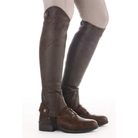 Kavalkade Remus oiled leather half chaps in brown paired with paddock boots, side profile on model | Malvern Saddlery