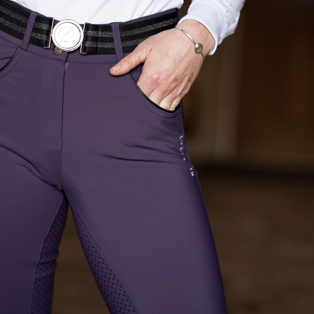 KL Select Gabrielle Full Seat Breeches - Blackberry, on person with hand in pocket | Malvern Saddlery