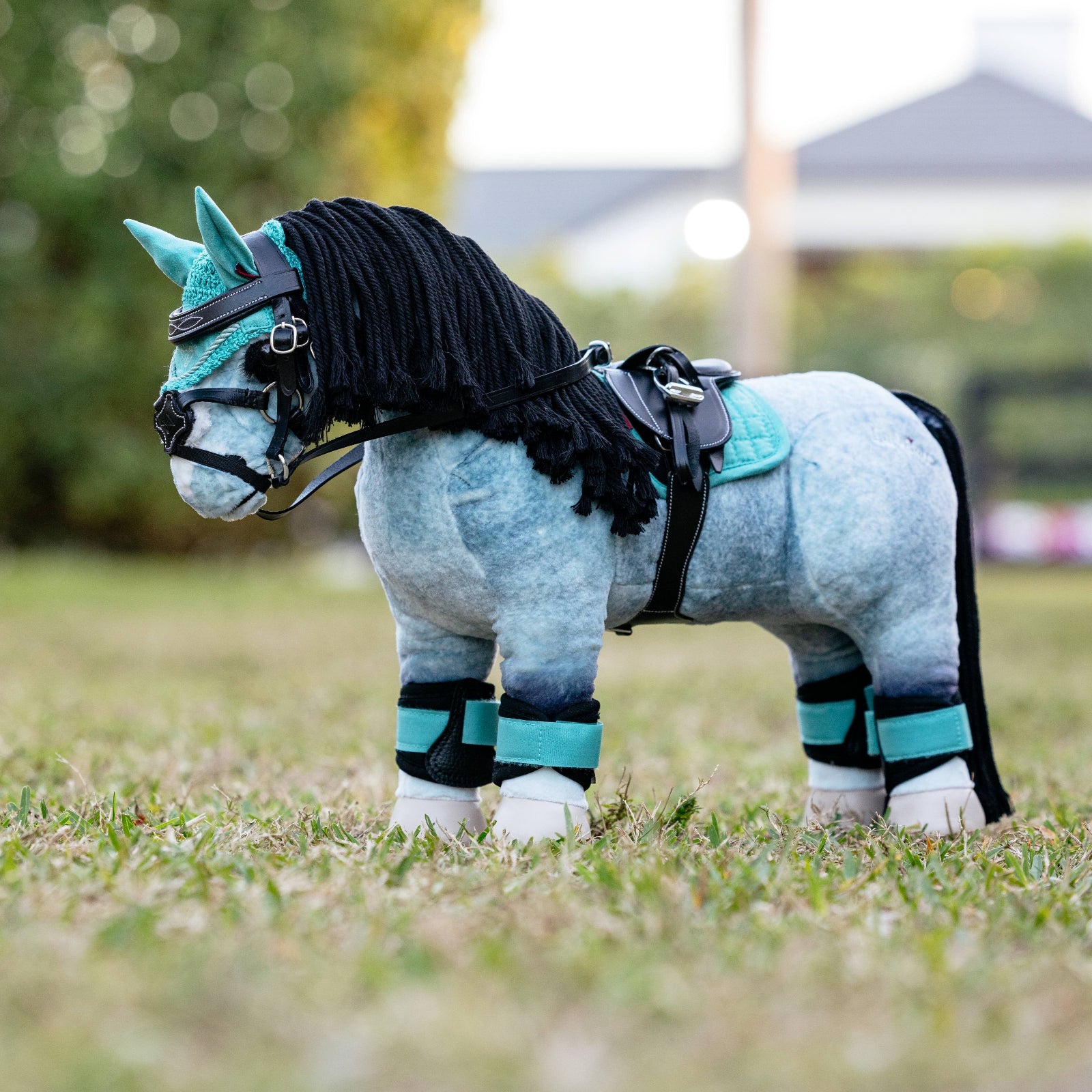 LeMieux Toy Pony Saddle Pad - Lagoon Blue, shown on 'Storm' with additional accessories | Malvern Saddlery