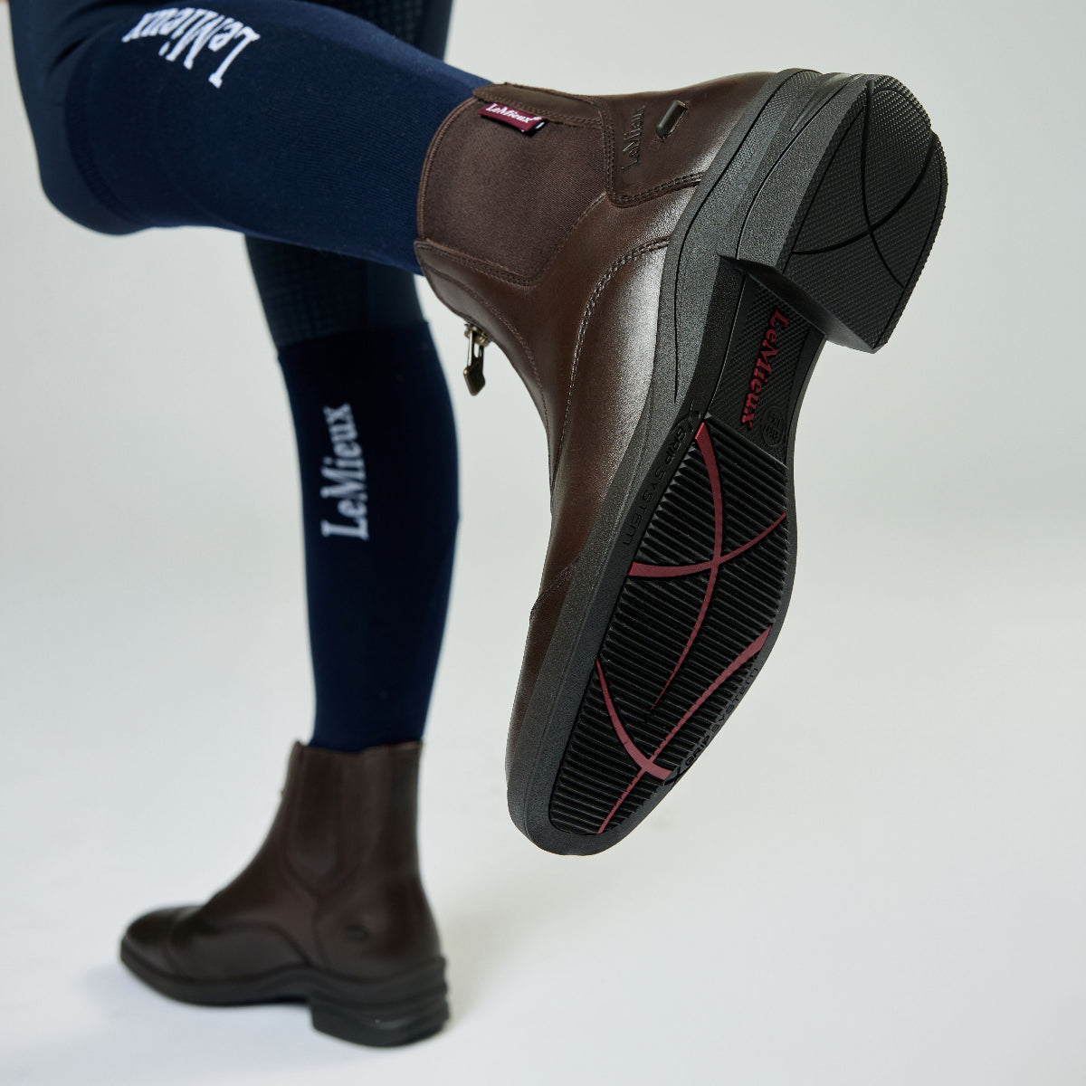 LeMieux Junior Zip Paddock Boots -Brown - on model showing side & sole | Malvern Saddlery