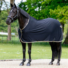 LeMieux Dress Cooler - Scrim - Black on Horse wearing a black rug standing on a path with trees in the background | Horse Blankets | Malvern Saddlery
