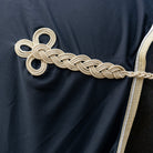 LeMieux Dress Cooler - Scrim - Black detail of braided cord hip ornament | Horse Blankets | Malvern Saddlery