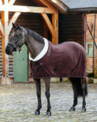LeMieux Kudos Luxe Fleece Blanket - Damson; shown on horse outside of barn | Horse Blankets | Malvern Saddlery