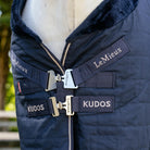 LeMieux Kudos Luxe Lined Stable Rug Navy; front closures detail shown on horse outdoors | Malvern Saddlery