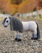 LeMieux Toy Pony - "Blanca", white plush with gray mane, shown on gravel road | Children's Toys | Malvern Saddlery