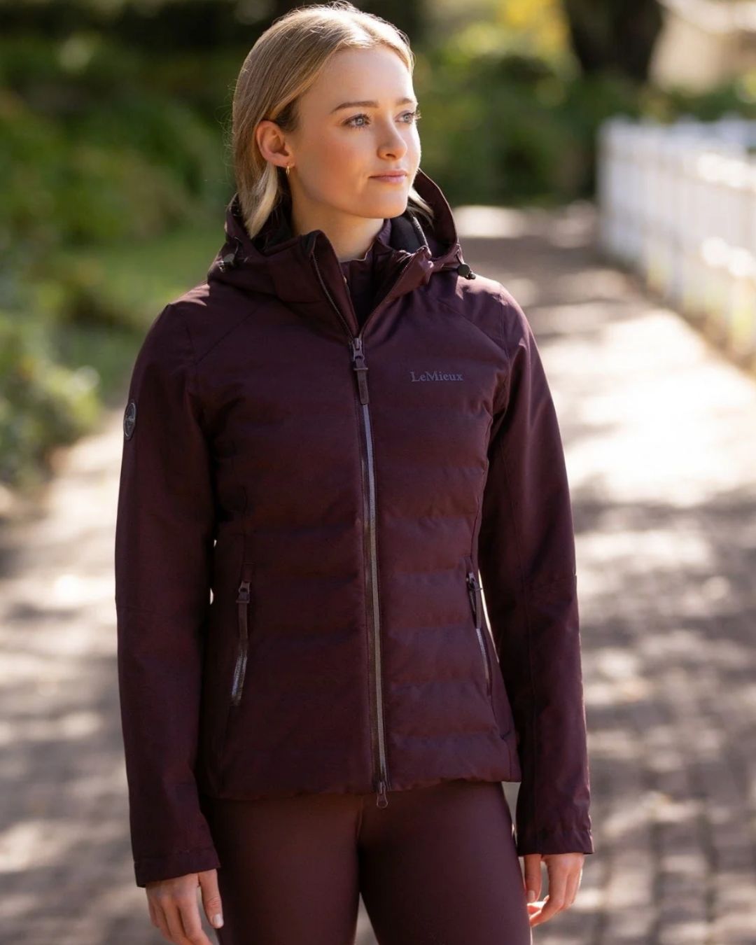 LeMieux Brooke Waterproof Hybrid Jacket - Damson [maroon] - shown on woman outdoors | Ladies' Outerwear | Malvern Saddlery
