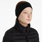 LeMieux Fleece Earwarmer Headband - Black; shown on woman wearing black puffer jacket | Malvern Saddlery