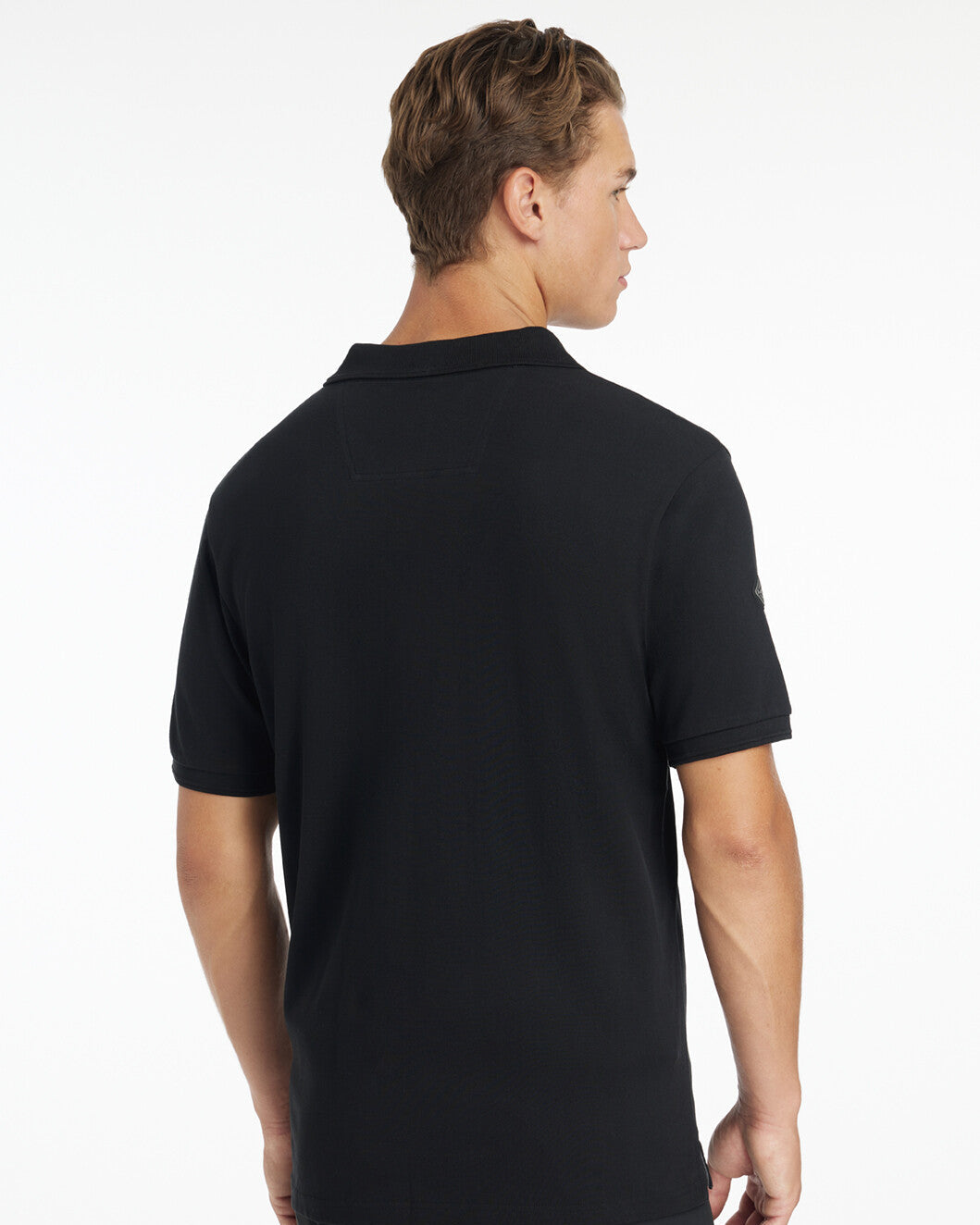 LeMieux Men's Classique Polo Shirt - Black - shown on man on white background - back view| Men's Athletic Wear | Malvern Saddlery