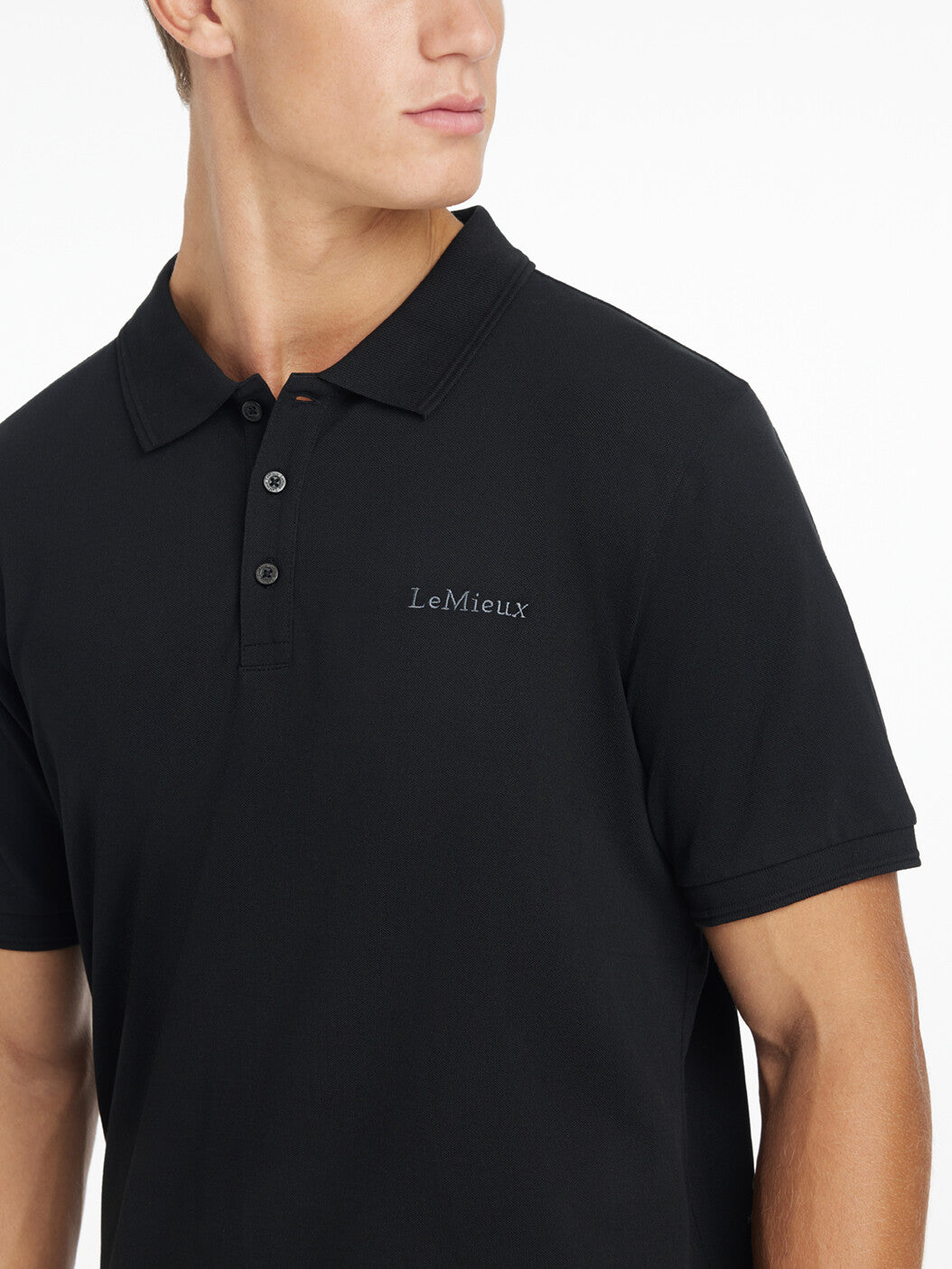 LeMieux Men's Classique Polo Shirt - Black - shown on man on white background | Men's Athletic Wear | Malvern Saddlery