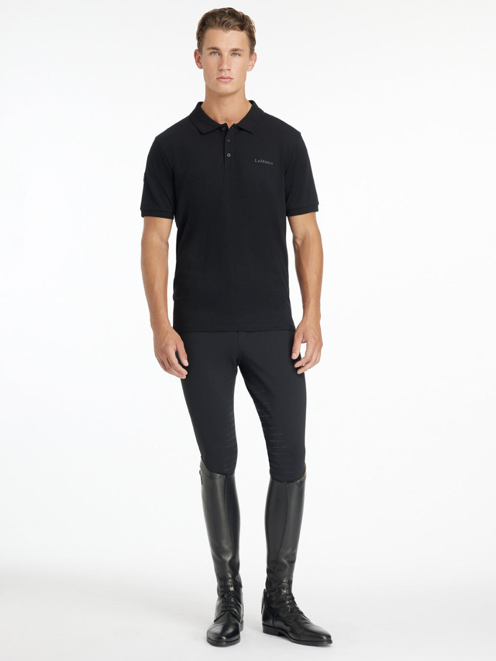 LeMieux Men's Classique Polo Shirt - Black - shown on man on white background, full body view | Men's Athletic Wear | Malvern Saddlery