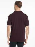 LeMieux Men's Classique Polo Shirt - Damson Red - shown on model with white background | Men's Athletic Wear | Malvern Saddlery