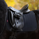 LeMieux Essence Dressage Saddle Pad -  on a horse with black saddle and a blurred natural background | Malvern Saddlery