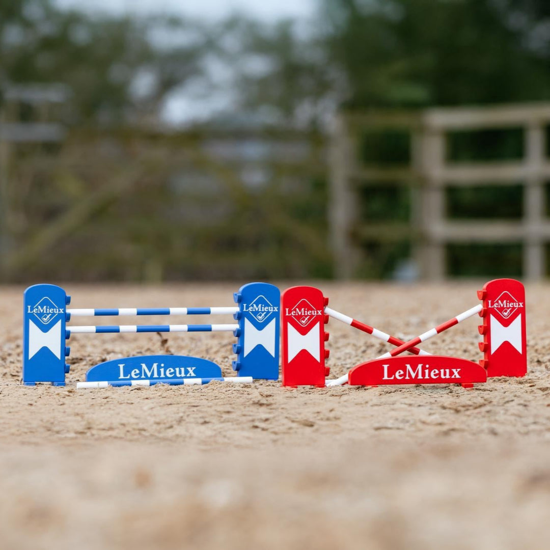 LeMieux Toy Pony Benetton Jump Set - shown outdoors on horse arena with trees in background | Malvern Saddlery