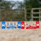 LeMieux Toy Pony Benetton Jump Set - shown outdoors on horse arena with trees in background | Malvern Saddlery