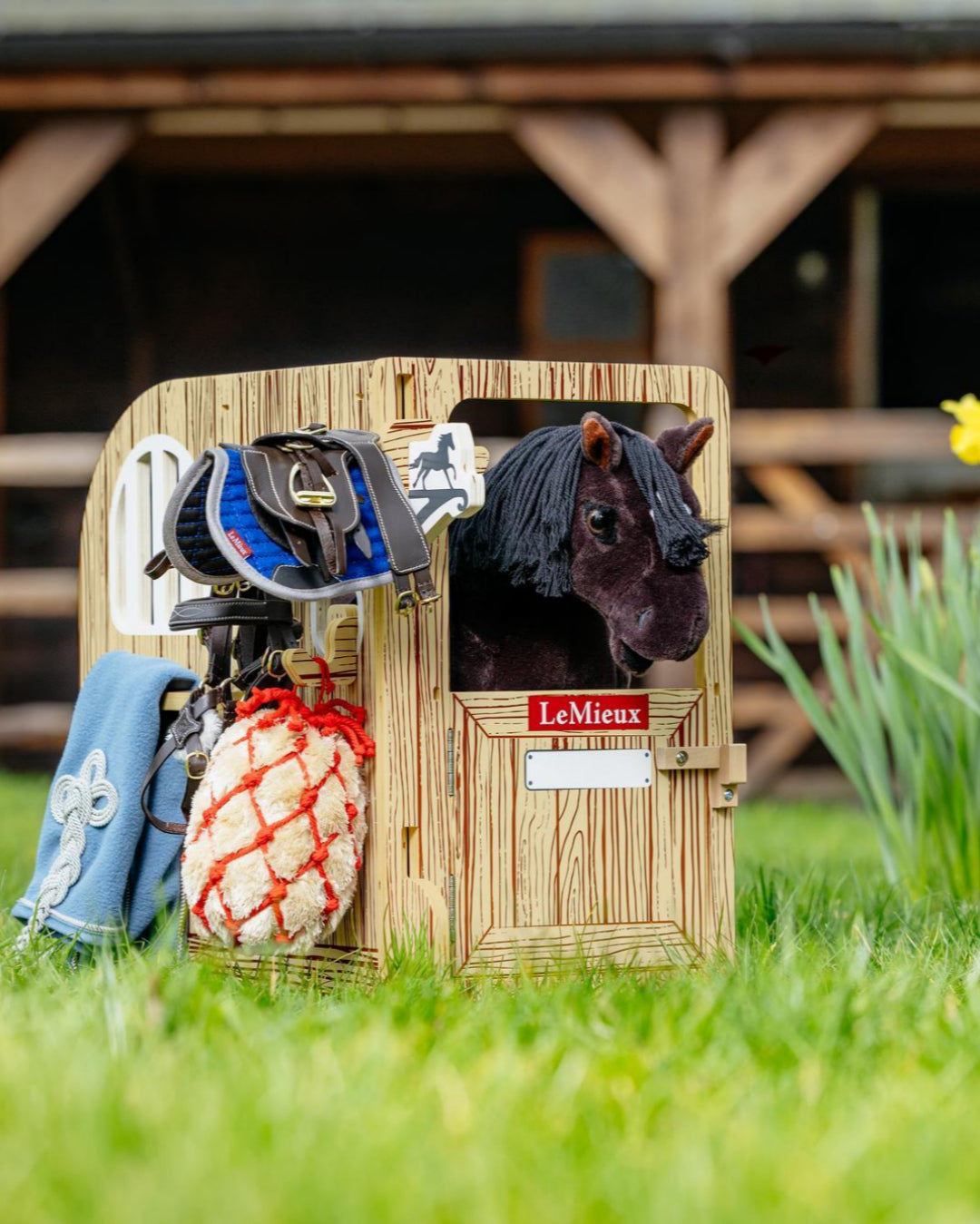 LeMieux Toy Pony Wooden Stable Set - shown in grass with barn in background | Malvern Saddlery