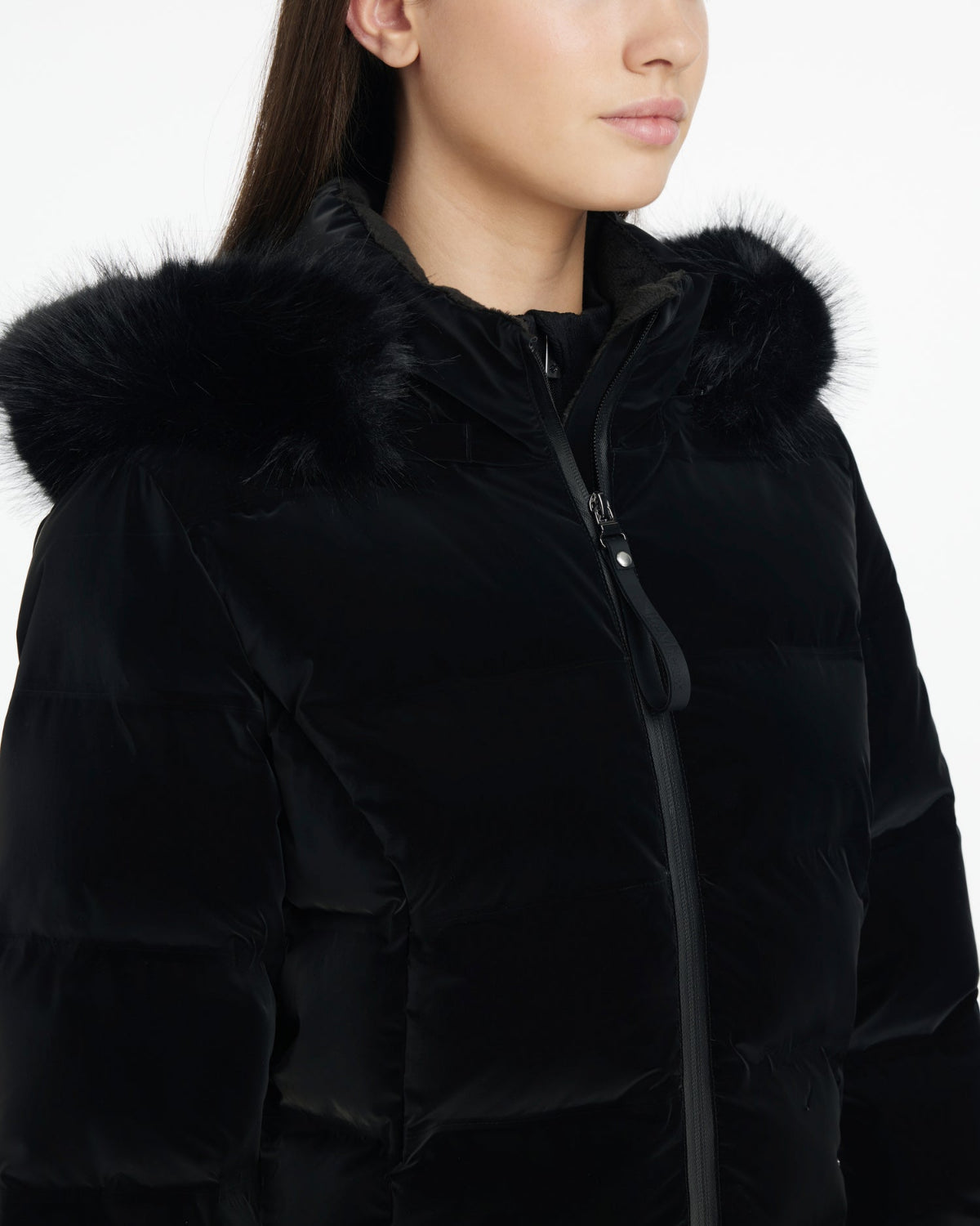 LeMieux Aspen Puffer Jacket - Black; close up chest view shown on model wearing riding pants & boots | Ladies' Outerwear | Malvern Saddlery