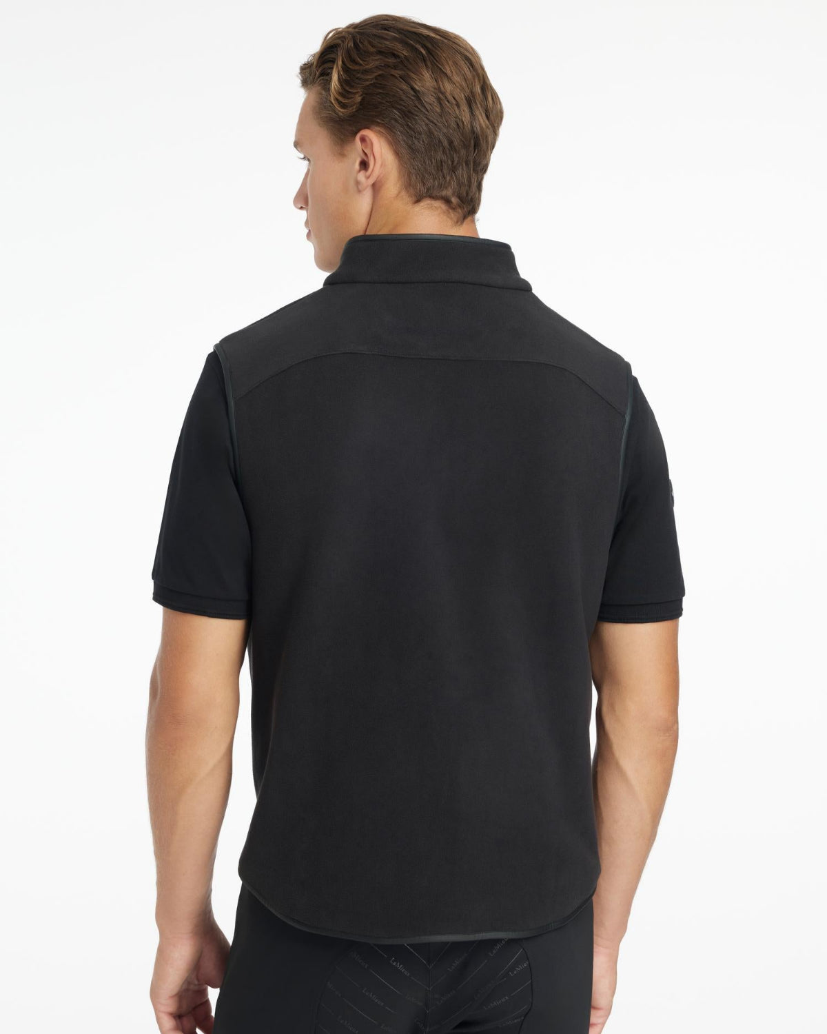 LeMieux Men's Fleece Gilet; Black shown on model, back view | Men's Clothing | Malvern Saddlery